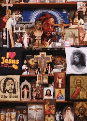 An assortment of religious memorabilia and artifacts featuring christian iconography and representations of Jesus.